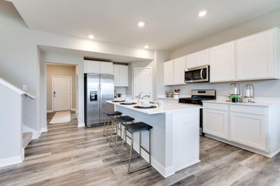 This beautiful and bright kitchen will make meal prep feel less like a chore and more like a treat! (Model home, colors will vary) | Image 1