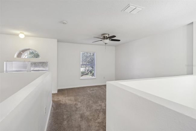 Upstairs loft makes the perfect home school area, play room or game room! | Image 14