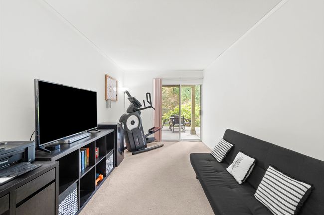 Carpeted living area featuring crown molding | Image 27