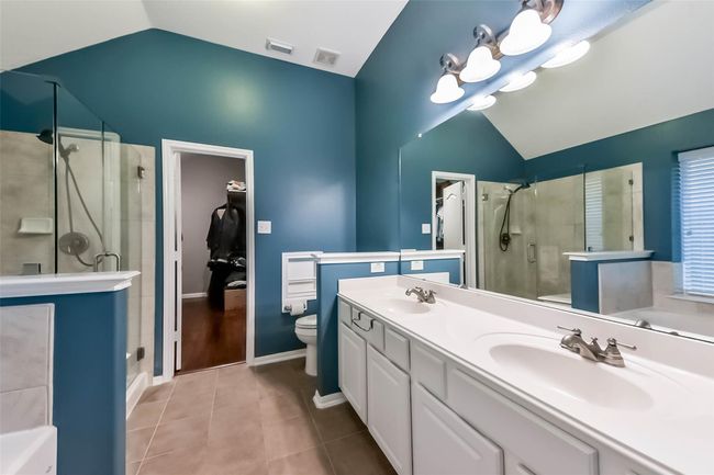 Master bath featuring double sinks, jacuzzi tub and new stand alone shower. | Image 15