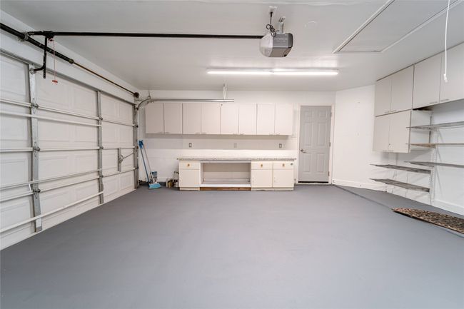 Garage with a garage door opener | Image 38