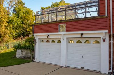 Two car garage with green house above. | Image 2