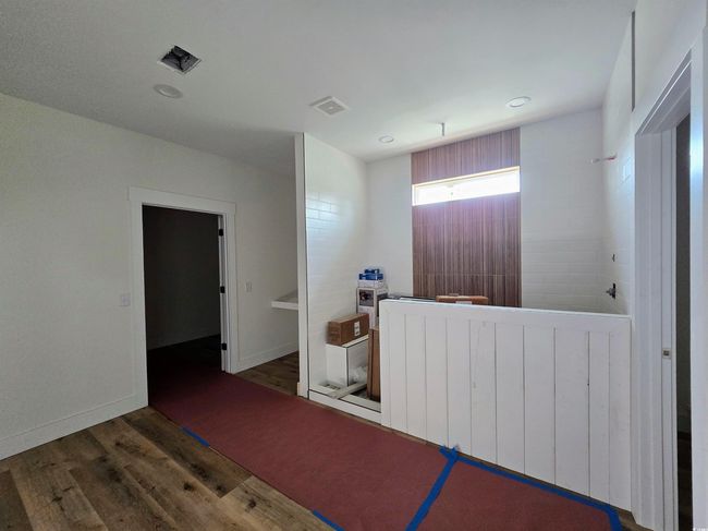Hallway with wood finished floors, recessed lighting, and baseboards | Image 23