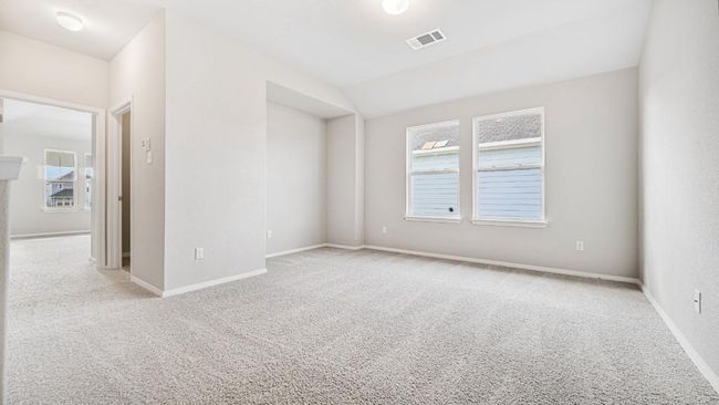 Empty room featuring carpet flooring and healthy amount of natural light | Image 16