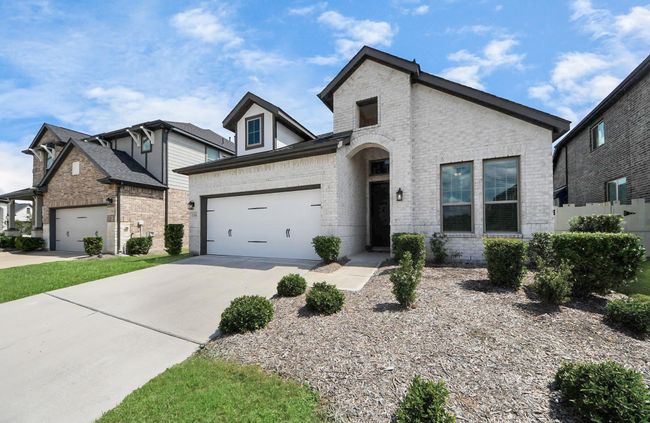 Beautiful curb appeal with a modern brick elevation and manicured landscaping | Image 5