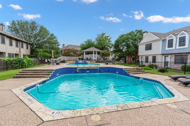 View of swimming pool with a patio, a gazebo, and a pool with connected hot tub | Image 21