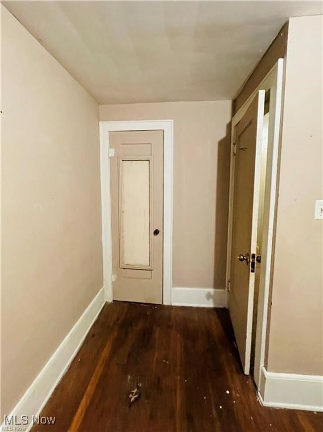 Hall featuring wood finished floors and baseboards | Image 15