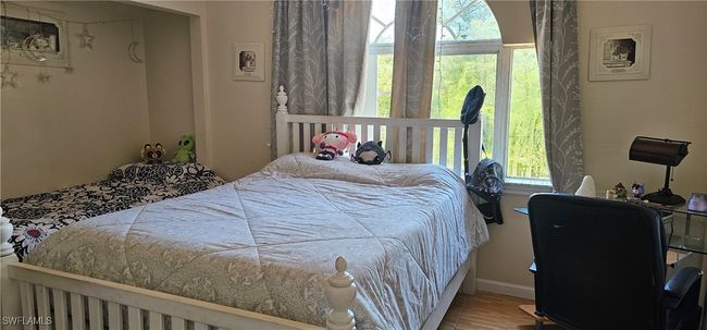 Bedroom featuring wood finished floors | Image 11
