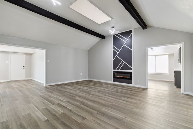 Bonus room with lofted ceiling with beams, light wood-style flooring, and baseboards | Image 14