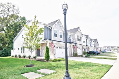 Nice corner unit. Neighborhood street lights and sidewalks. | Image 1