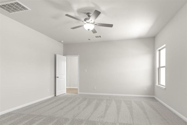 Unfurnished room with baseboards, visible vents, light colored carpet, and a ceiling fan | Image 20