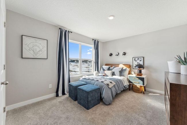 The other secondary bedroom upstairs. Large and light filled, there's space to stretch out. Photo of model home, colors and finishes will vary. | Image 32