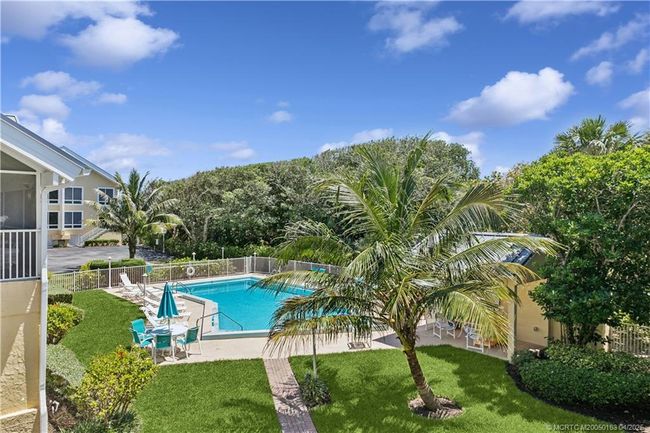 View of pool from outdoor patio space | Image 10