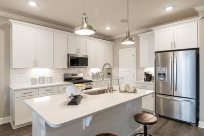 Che's kitchen! This home will feature built in wall oven/microwave with wood hood. | Image 2