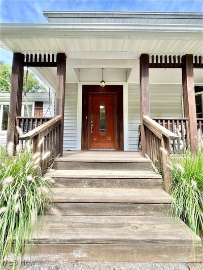 View of exterior entry featuring a porch | Image 3