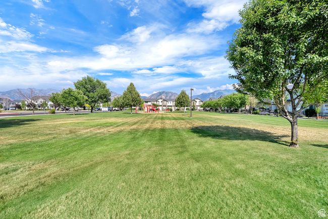 View of community with a mountain view and a yard | Image 33