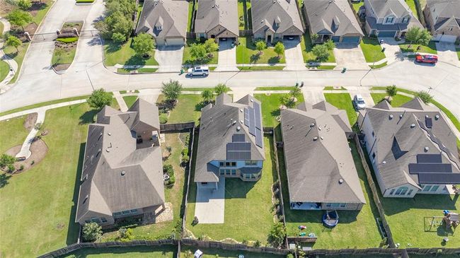 Birds eye view shows the beautiful size of the yard and the lot placement nestled into the gated section of the Falls. | Image 34