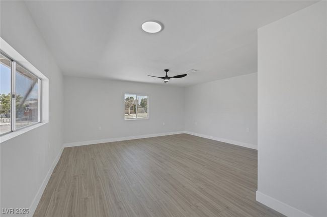 Unfurnished room featuring a ceiling fan and light wood-type flooring | Image 19