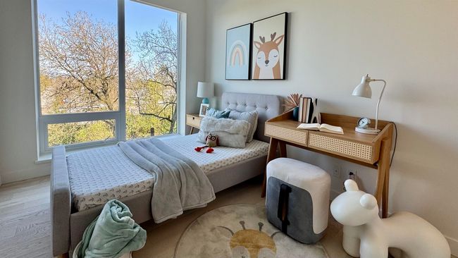 Bedroom with wood finished floors | Image 12