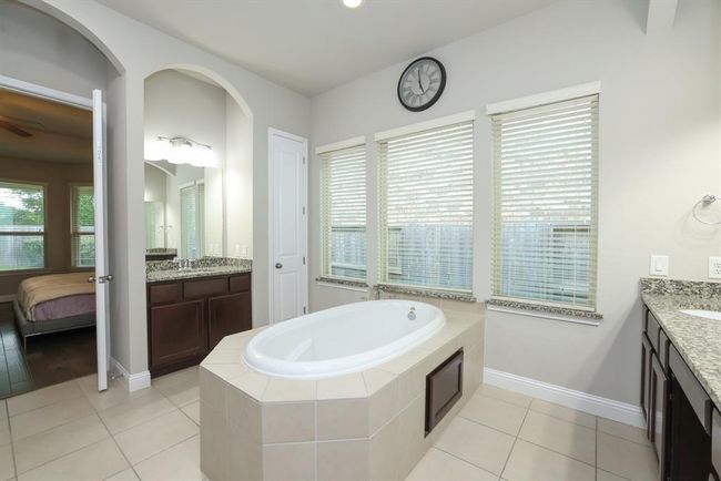 Convenient cabinet door below tub for ease in getting to plumbing | Image 34