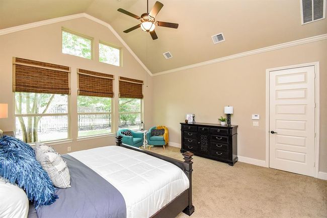 Enjoy a comfortable seating area! Tall 9 foot doors throughout this home and crown moldiing! | Image 24