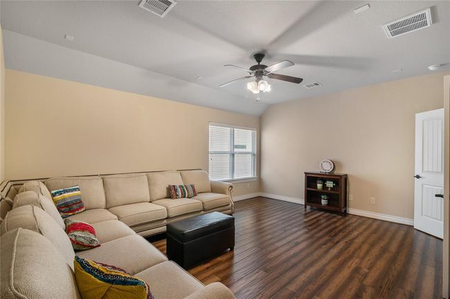 Impressive media room accommodating enough space for comfortable seating to enjoy a movie night. | Image 25