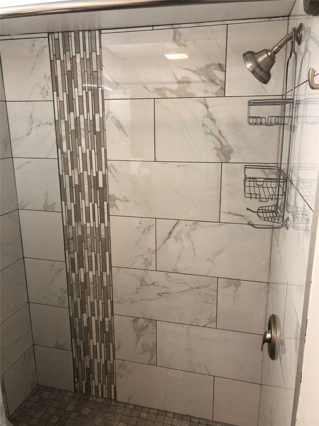 Bathroom featuring tiled shower | Image 13