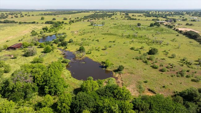 Another aerial view from the back of the property. You see all three ponds and the barn from here. | Image 22