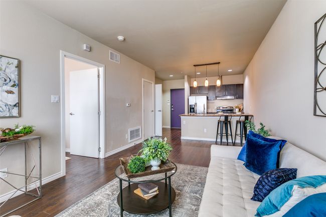 Living room with dark wood-style floors and recessed lighting | Image 5