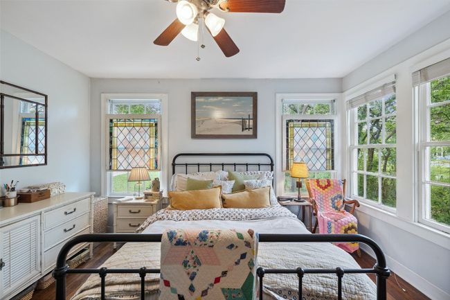 Bedroom #1 with beautiful stained glass windows, real hardwood floors, and tons of natural light | Image 31