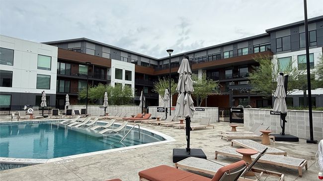Community pool with a patio area | Image 22
