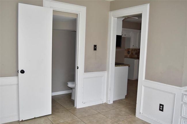 breakfast/flex area with access to half bath | Image 18