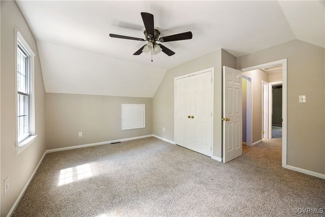 2nd bedroome featuring lofted ceiling, carpet floors, and ceiling fan | Image 17