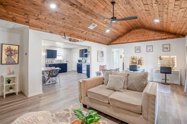 An open-concept floorplan connects living, dining, and kitchen spaces—designed for easy everyday living and entertaining. | Image 9