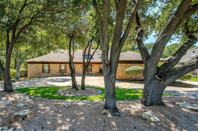 Single story home featuring a patio area | Image 1