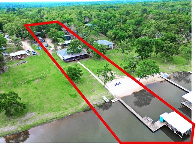Birds eye view of property with a wooded view and a water view | Image 27