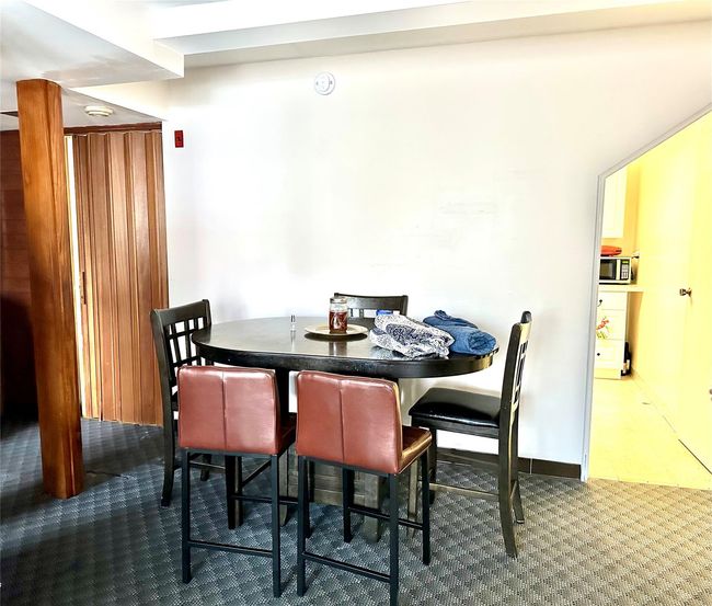 View of carpeted dining area | Image 27