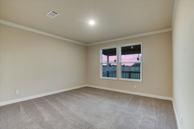Carpeted empty room featuring ornamental molding and baseboards | Image 14