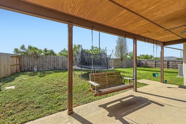 Covered Back Porch In The Large Fully Fenced Backyard | Image 26