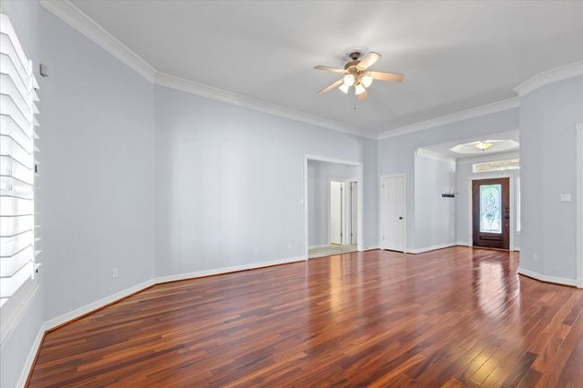 A generous second living area offers the perfect setting for a game room or media space. | Image 10