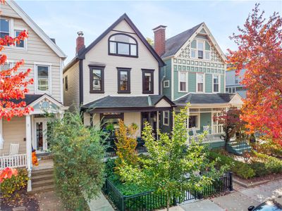 Beautifully landscaped front yard. Plenty of new items in this house- outside and inside. New windows, new roof! | Image 2