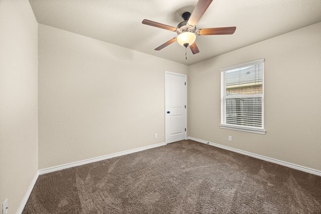 Empty room with carpet and a ceiling fan | Image 22