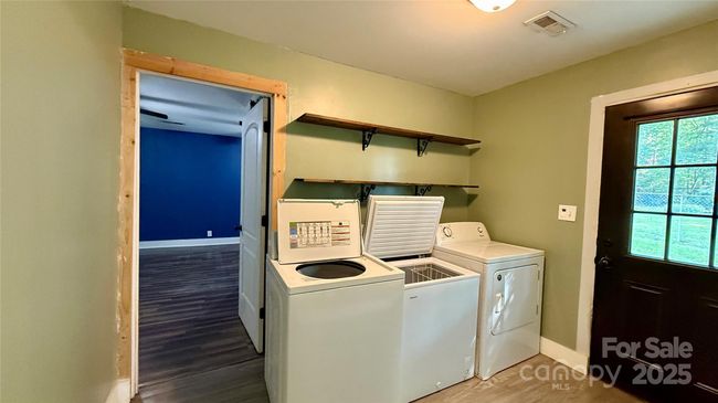 Laundry Room with Back main Bedroom | Image 14