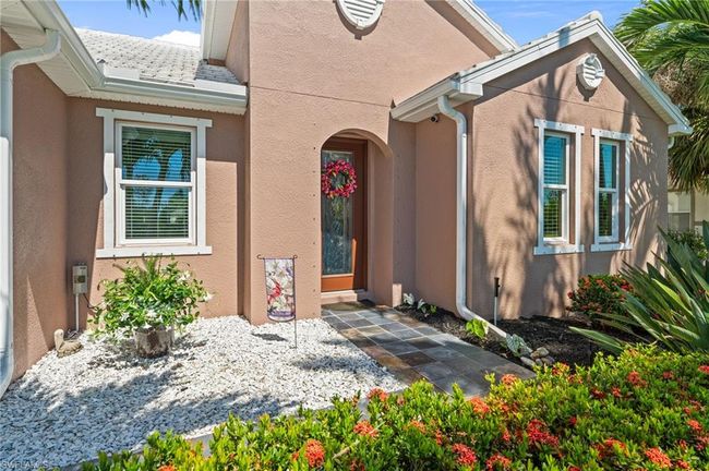Doorway to property with stucco siding | Image 11