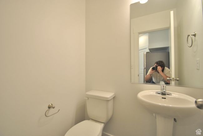 Bathroom featuring toilet | Image 6
