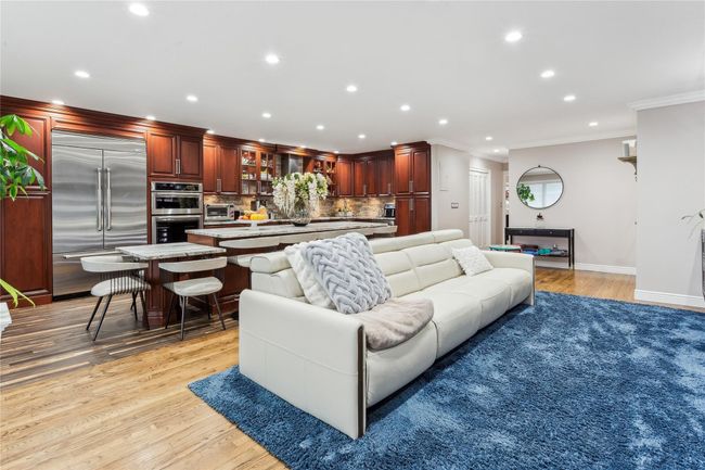 Living room featuring light hardwood / wood-style flooring and ornamental molding | Image 6