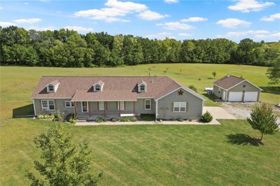 View of front of house with a front lawn and covered porch | Image 1