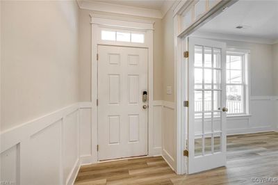 Photo represents the plan, not the actual home. Design selections may vary. Upon entering, you'll find a home office with French doors off the foyer. | Image 2