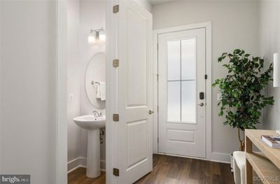 Half Bathroom main level with hardwood / wood-style floors and sink | Image 2