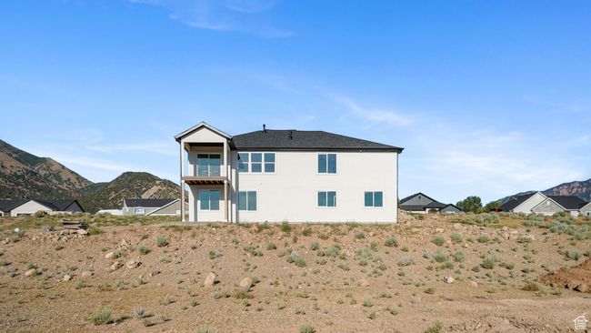 Back of house featuring a mountain view and stucco siding | Image 28